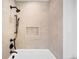Clean bathroom showcasing a shower and tub combo with modern fixtures and a tiled design at 4236 Zuni St, Denver, CO 80211