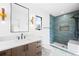 Contemporary bathroom showcases a walk-in shower with blue tiling, marble floors, and unique lighting fixtures at 4236 Zuni St, Denver, CO 80211