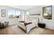 Well-lit bedroom with large windows, stylish furnishings, and modern decor at 4236 Zuni St, Denver, CO 80211