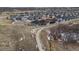 Aerial view of a residential area, showcasing well-maintained homes and a peaceful community setting at 1610 Cade Ave, Castle Rock, CO 80104