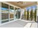 View of sliding glass doors leading to a covered patio with a ceiling fan at 1610 Cade Ave, Castle Rock, CO 80104