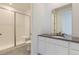 Modern bathroom with subway tile shower, glass door, and sleek vanity at 39867 Floyd St, Elizabeth, CO 80107