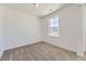 Well-lit bedroom with neutral decor featuring a large window, perfect for a relaxing retreat at 39867 Floyd St, Elizabeth, CO 80107