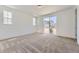 Bright bedroom with a neutral palette, plush carpet, and sliding glass doors to outdoor space at 39867 Floyd St, Elizabeth, CO 80107