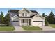 Charming two-story home with a two-car garage and a well-manicured front yard in a suburban neighborhood at 39867 Floyd St, Elizabeth, CO 80107