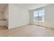 Bright living room with light wood floors, a large window and recessed lights at 39867 Floyd St, Elizabeth, CO 80107