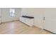 Open living area features light wood floors, a counter and storage, and great natural light at 39867 Floyd St, Elizabeth, CO 80107