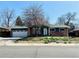 Charming brick home with a two-car garage and well-maintained front yard at 2964 S Yates St, Denver, CO 80236