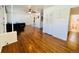 Spacious living room with hardwood floors, archways, and white accents throughout at 2964 S Yates St, Denver, CO 80236