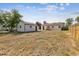 Large backyard with detached garage and patio area, perfect for outdoor activities at 970 S Canosa Ct, Denver, CO 80219