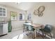 Sunlit dining area with modern decor, tiled floors, and a cozy, inviting atmosphere at 970 S Canosa Ct, Denver, CO 80219