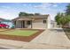 Inviting single-story home with a well-manicured lawn and convenient detached garage at 970 S Canosa Ct, Denver, CO 80219