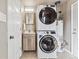 Functional laundry area with stacked washer and dryer, maximizing space at 970 S Canosa Ct, Denver, CO 80219