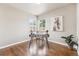 Well lit office with hardwood floors, corner windows and unique artwork at 970 S Canosa Ct, Denver, CO 80219
