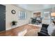 Bright open-plan living room showcasing hardwood floors, dining area and stylish interior decor at 1781 Uinta St, Denver, CO 80220