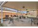 Covered patio with ample seating and grilling area, perfect for outdoor gatherings at 1781 Uinta St, Denver, CO 80220
