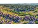 Stunning aerial view of the community showcasing lush landscaping and a network of walking trails at 9246 Sori Ln, Highlands Ranch, CO 80126