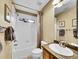 Bright bathroom featuring a shower-tub combo, a modern vanity, and neutral tones, creating a clean and inviting space at 9246 Sori Ln, Highlands Ranch, CO 80126