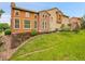 A lovely view of the house's exterior, featuring beautiful stonework and an attractive garden area at 9246 Sori Ln, Highlands Ranch, CO 80126