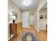 Inviting hallway with hardwood floors, decorative rug, and classic furnishings at 9246 Sori Ln, Highlands Ranch, CO 80126