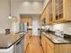 Updated kitchen with granite countertops, stainless steel appliances and wood cabinets at 9246 Sori Ln, Highlands Ranch, CO 80126
