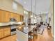Bright kitchen with granite countertops, stainless steel appliances, and an open layout to the dining area at 9246 Sori Ln, Highlands Ranch, CO 80126
