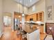 Spacious kitchen featuring an island, stainless steel appliances, and natural wood cabinets at 9246 Sori Ln, Highlands Ranch, CO 80126