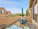 Charming patio offers neighborhood views, a cozy seating area, and bright blue cushions, ideal for relaxation at 9246 Sori Ln, Highlands Ranch, CO 80126