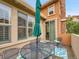 Outdoor patio with a table, chairs, and a green umbrella, offering a perfect space for outdoor dining at 9246 Sori Ln, Highlands Ranch, CO 80126