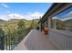 Relax on this deck with a storage bench and a lovely wooded view at 960 Aspen Pl, Evergreen, CO 80439