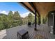 Spacious deck with stylish seating and beautiful mountain views at 960 Aspen Pl, Evergreen, CO 80439