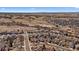 Expansive aerial view of a residential community in a scenic, semi-arid landscape with mountain backdrop at 21142 Hawthorne Ln, Parker, CO 80138