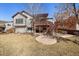 Spacious backyard with upper deck, patio, and plenty of room for outdoor activities at 21142 Hawthorne Ln, Parker, CO 80138