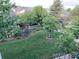 Overhead view of a backyard showcasing lush greenery and a wooden fence at 21142 Hawthorne Ln, Parker, CO 80138