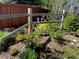 Landscaped yard with wooden fence and a variety of plants and foliage at 21142 Hawthorne Ln, Parker, CO 80138