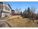 Well-maintained backyard featuring mature trees and a lovely lawn, creating a private outdoor space at 21142 Hawthorne Ln, Parker, CO 80138