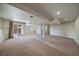 Expansive carpeted basement featuring an outdoor entrance and recessed lighting at 21142 Hawthorne Ln, Parker, CO 80138