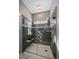 Beautiful walk-in shower with tiled walls, glass enclosure, and modern fixtures at 21142 Hawthorne Ln, Parker, CO 80138