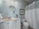 Cozy bathroom features a decorative mirror, vanity, and shower at 21142 Hawthorne Ln, Parker, CO 80138