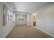 Bright bedroom featuring a view out of two windows and an attached bathroom at 21142 Hawthorne Ln, Parker, CO 80138