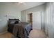 Comfortable bedroom with a ceiling fan, bright window, and closet with sliding doors at 21142 Hawthorne Ln, Parker, CO 80138