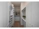 Walk-in closet with ample shelving for optimal organization and storage at 21142 Hawthorne Ln, Parker, CO 80138