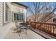 Open-air deck showcasing a metal table with seating, perfect for enjoying outdoor meals and fresh air at 21142 Hawthorne Ln, Parker, CO 80138