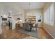 Charming dining room next to the kitchen with hardwood floors and natural light streaming through the window at 21142 Hawthorne Ln, Parker, CO 80138