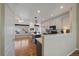 Eat-in kitchen featuring modern appliances, center island and hardwood floors that are ideal for everyday cooking at 21142 Hawthorne Ln, Parker, CO 80138