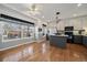 Bright eat-in kitchen featuring modern appliances, center island, breakfast nook and hardwood floors, ideal for cooking and dining at 21142 Hawthorne Ln, Parker, CO 80138