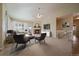 Spacious living room featuring a cozy fireplace, neutral tones and ceiling fan, perfect for relaxation and entertaining at 21142 Hawthorne Ln, Parker, CO 80138