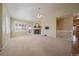 Inviting living room features a fireplace, neutral tones and direct access to the outdoors, providing a great flow at 21142 Hawthorne Ln, Parker, CO 80138