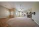 Bright living room with neutral tones, vaulted ceiling, fireplace and ample windows offering tons of natural light at 21142 Hawthorne Ln, Parker, CO 80138