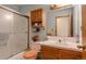 Comfortable bathroom with shower, single sink, and tile at 2912 Lake Park Way, Longmont, CO 80503